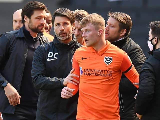 Portsmouth FC manager Danny Cowley  leads an angry Portsmouth FC midfielder Andy Cannon (14) away during the EFL Sky Bet League 1 match between Milton Keynes Dons and Portsmouth at stadium:mk, Milton Keynes, England on 17 April 2021. Picture: Dennis Goodwin