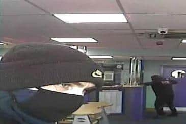 Masked robbers pictured attempted to raid the Coral betting shop in Gosport. Photo: Hampshire police