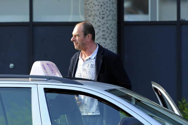 Vile yob Gary Saunders has been jailed for coughing at a shopper's face during a check-out row in Portsmouth.