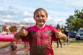 Dirty but happy at the end of the Pretty Muddy kids race. Picture: Mike Cooter (020722)