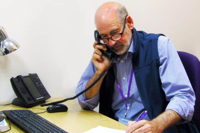 Craig Lawrence from Carers Support West Sussex helps another caller