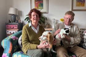 Janeen Davis, Simon Davis, and their cat, 'Miracle' and dog, 'Molly'.