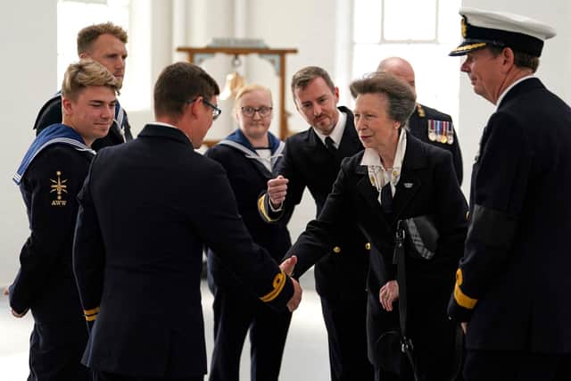 Britain's Princess Anne (2ndR), Princess Royal, as Commodore-in-Chief Portsmouth, meets with Royal Navy personnel, who took part in Queen Elizabeth II's funeral procession, at Portsmouth Naval Base on September 22, 2022. Photo by ANDREW MATTHEWS/POOL/AFP via Getty Images)