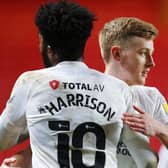 Harvey White celebrates Pompey's win at Charlton with Ellis Harrison after coming on as a late sub. Picture: Joe Pepler