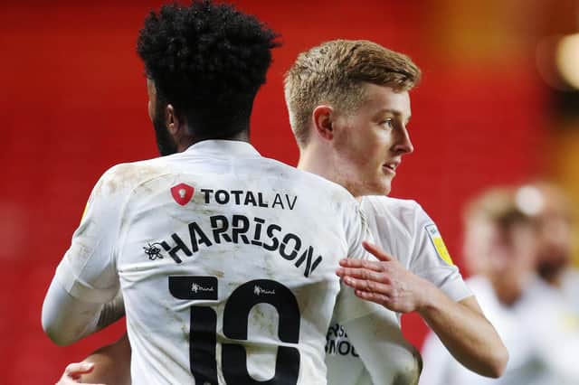 Harvey White celebrates Pompey's win at Charlton with Ellis Harrison after coming on as a late sub. Picture: Joe Pepler