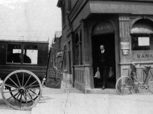 Old Lloyds bank. Not the wild west but perhaps wild east. A bank teller loads cash from the bank on the corner of Glasgow Road, Eastney.