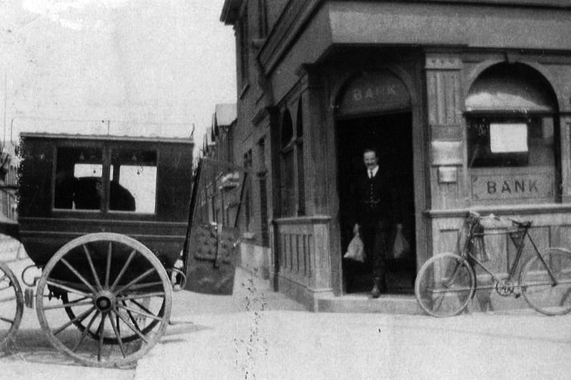 Old Lloyds bank. Not the wild west but perhaps wild east. A bank teller loads cash from the bank on the corner of Glasgow Road, Eastney.