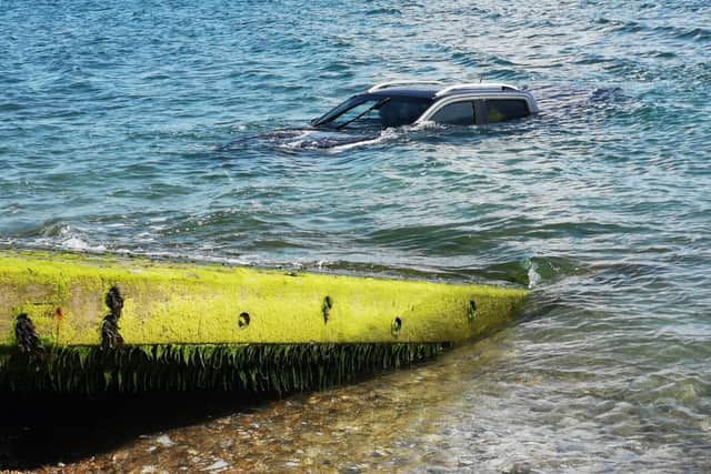 The car on the dive ramp at East Beach, Selsey. Picture courtesy of Selsey Coastguard Rescue Team