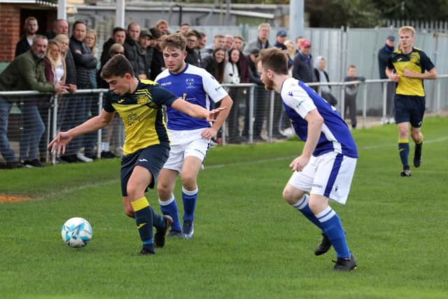 Moneyfields' Josh Bailey is closely marked by two Denmead players.

Photograph by Sam Stephenson