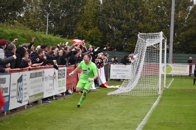 Jon Webb celebrates in front of the Fareham fans after saving a second Jersey Bulls penalty to give his side a shoot-out victory in the FA Vase. Picture: Paul Proctor