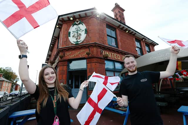 Supervisor Kara Horsburgh and general manager Lawrence Hall get behind England at The Shepherds Crook pub, Fratton, for Euro 2020
Picture: Chris Moorhouse (jpns 110621-49)