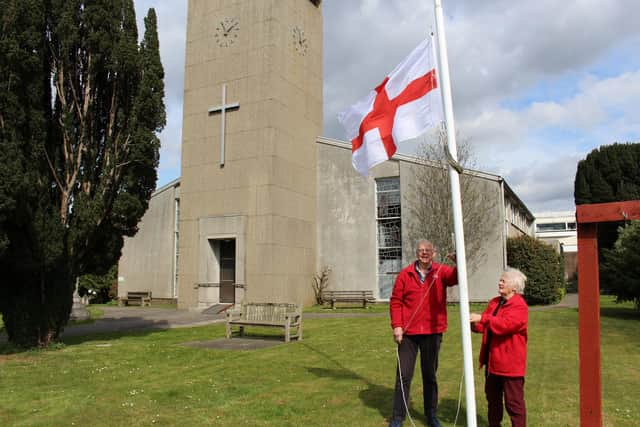 Tony and Jane Rice-Oxley fly the flag at half-mast outside St George's Church. Picture: Emily Turner