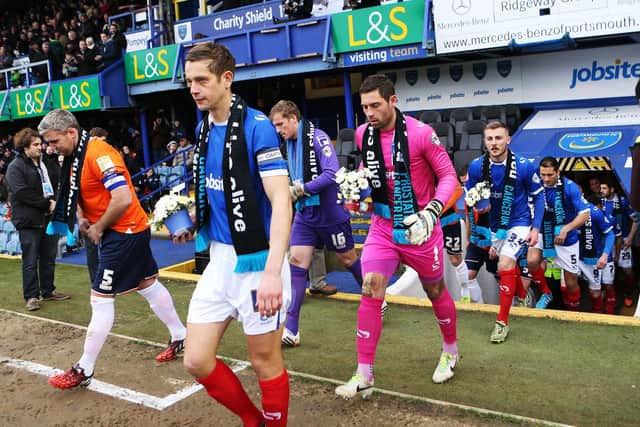 Paul Jones is led out by skipper Paul Robinson against Luton in March 2015. Picture: Joe Pepler