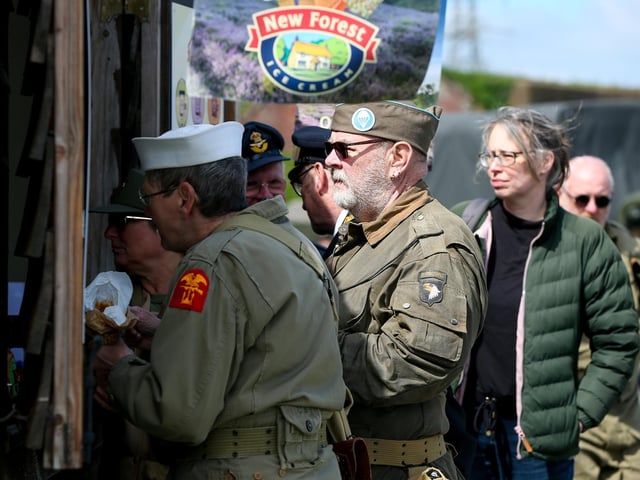Re-enactors queue for ice creams.