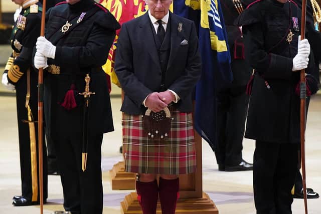 Britain's King Charles III, center, and other members of the royal family hold a vigil at the coffin of Queen Elizabeth II at St Giles' Cathedral, Edinburgh, Scotland,  Monday Sept. 12, 2022. (Jane Barlow/Pool via AP)