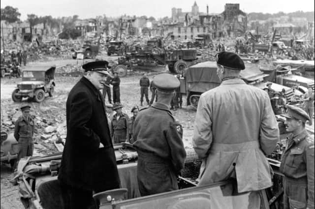 Prime minister Winston Churchill, Sir Miles Dempsey, British 2nd Army commandant, and Field Marshal Bernard Montgomery visit the destroyed city of Caen, on July 23, 1944 after Allied forces stormed the Normandy beaches on D-Day. Picture: Getty
