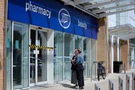 Customers read the signs on the door at Boots, which is closed after flooding at Ocean Retail Park in Portsmouth
Picture: Chris Moorhouse (jpns 280721-37)