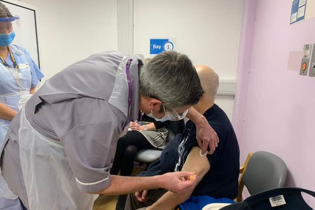 Peter Missing is the first person to have a jab at the coronavirus mass vaccination hub at St James's Hospital in Milton
Picture: Sarah Standing