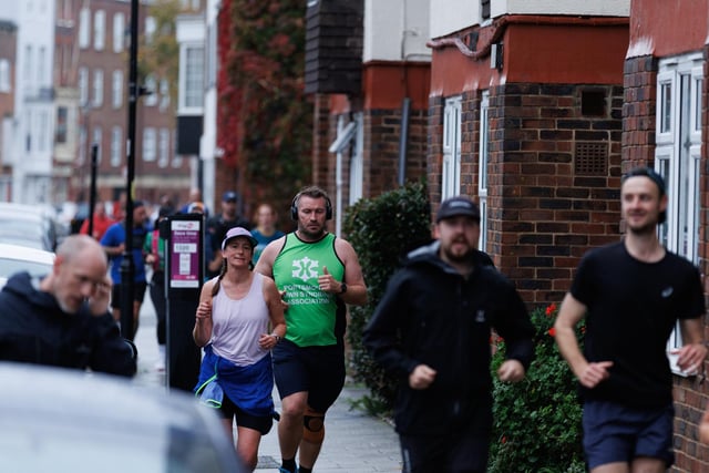 Runners hit the streets in wet and windy conditions despite The Great South Run being cancelled.