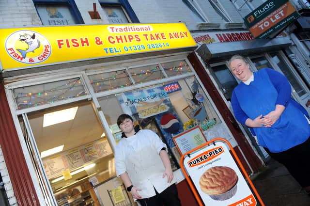 Freyah Tyrrell, fish and chip shop assistant with owner Rebecca Traynor.
Picture: Sarah Standing (190221-3298)