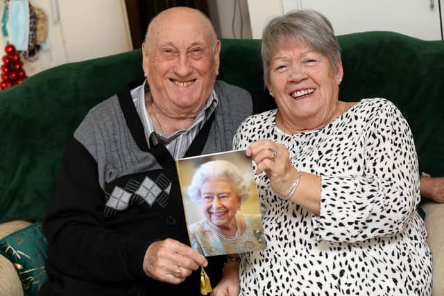 Harry and Vera Davies pictured celebrating their Diamond Wedding anniversary holding a card from the Queen.

They are pictured at their home in Southsea.

Picture: Sam Stephenson