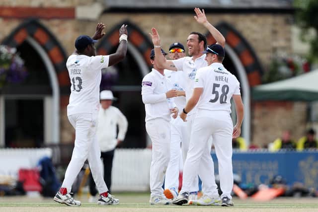 Hat-trick hero Kyle Abbott celebrates with teammates after taking one of his six second innings wickets at Cheltenham. Photo by Ryan Hiscott/Getty Images