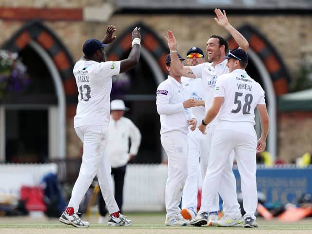 Hat-trick hero Kyle Abbott  celebrates with teammates after taking one of his six second innings wickets at Cheltenham. Photo by Ryan Hiscott/Getty Images