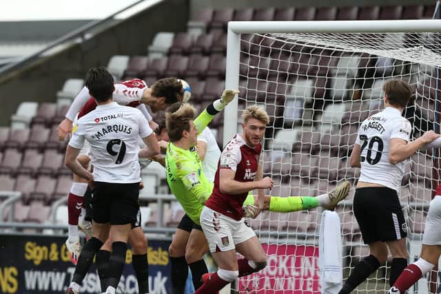 NORTHAMPTON, ENGLAND - MARCH 06: Fraser Horsfall of Northampton Town scores his sides third goal during the Sky Bet League One match between Northampton Town and Portsmouth at PTS Academy Stadium on March 06, 2021 in Northampton, England. (Photo by Pete Norton/Getty Images)