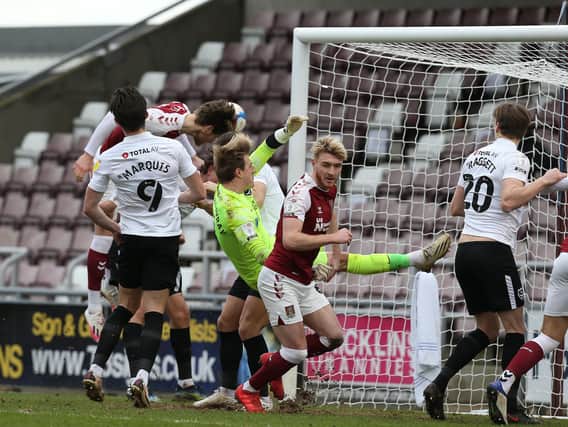 NORTHAMPTON, ENGLAND - MARCH 06: Fraser Horsfall of Northampton Town scores his sides third goal during the Sky Bet League One match between Northampton Town and Portsmouth at PTS Academy Stadium on March 06, 2021 in Northampton, England. (Photo by Pete Norton/Getty Images)