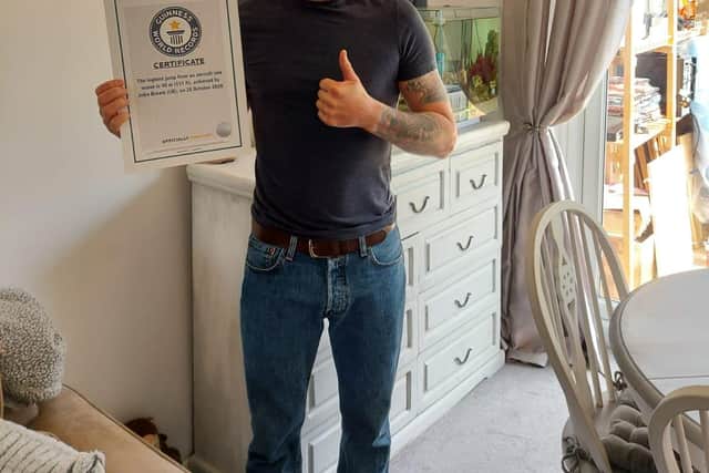 John Bream with his certificate from the Guinness Book of records.