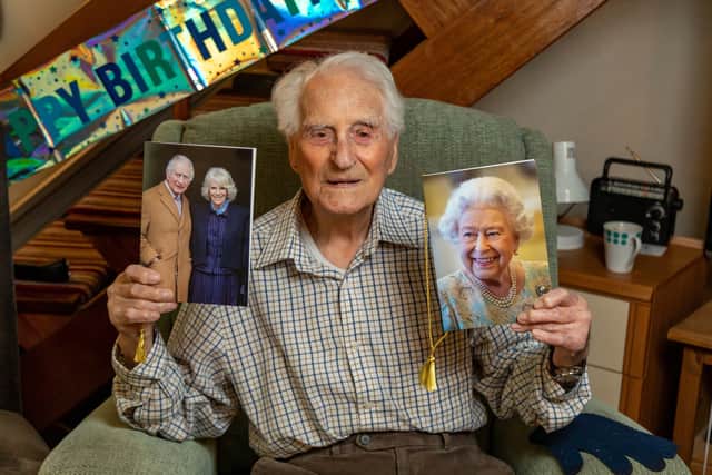 Eric Moore with the card he received on his 108th birthday - alongside one of his previous cards from the Queen. Picture: Mike Cooter (110324)