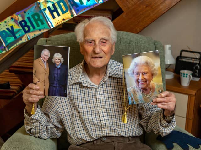 Eric Moore with the card he received on his 108th birthday - alongside one of his previous cards from the Queen. Picture: Mike Cooter (110324)