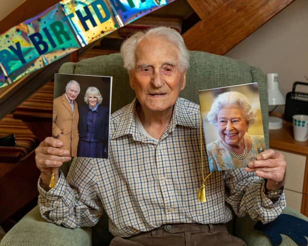 Eric Moore with the card he received on his 108th birthday - alongside one of his previous cards from the Queen. Picture: Mike Cooter (110324)