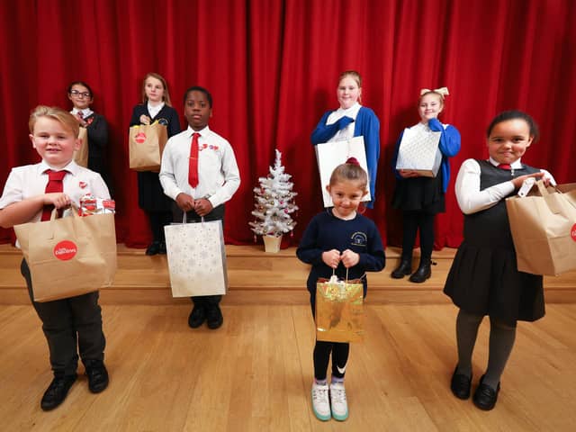 From left, Teddy, 7, Elizabetta, 10, Alicia, 10, Mark, 10, Freya, 10, Nellie, 5, Betty, 8 and Isabelle, 7, with their kindness bags. The children are from St Paul's Catholic Primary School, Beacon View Primary School, and Victory Primary School. The bags will be given to local families at Christmas. Picture: Chris Moorhouse (jpns 071221-18)