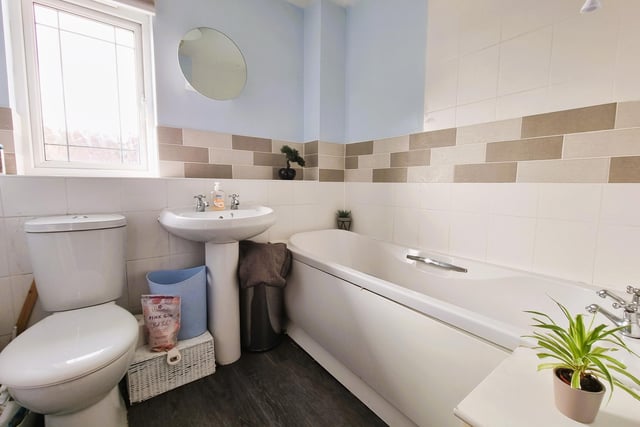 The bathroom comes with a panelled bath with shower attachment.