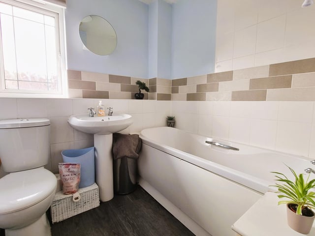 The bathroom comes with a panelled bath with shower attachment.