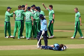 James Vince walks off dejected after being dismissed by Ireland's Craig Young following a review during the third ODI at The Ageas Bowl. skipper Eoin Morgan does some stretching exercises at the same time. Pic: Mike Hewitt/NMC Pool