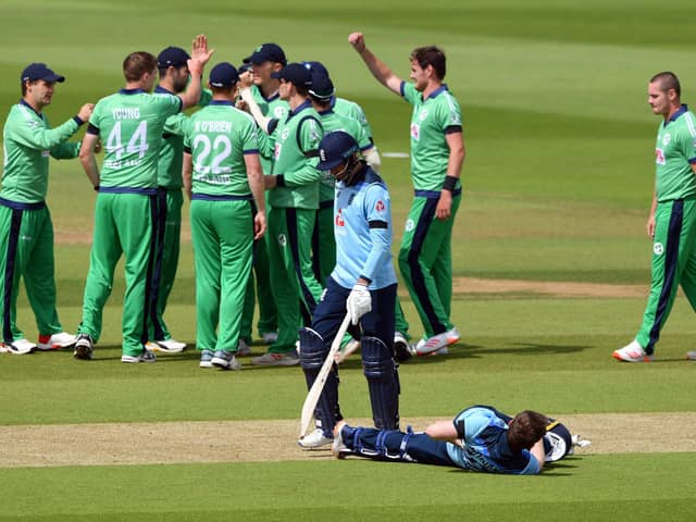 James Vince walks off dejected after being dismissed by Ireland's Craig Young following a review during the third ODI at The Ageas Bowl. skipper Eoin Morgan does some stretching exercises at the same time. Pic: Mike Hewitt/NMC Pool