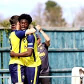 Dan Wooden, left, celebrates after netting against Salisbury with team-mate Billie Busari Picture: Tom Phillips