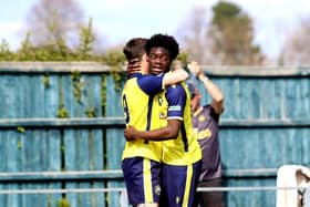 Dan Wooden, left, celebrates after netting against Salisbury with team-mate Billie Busari Picture: Tom Phillips