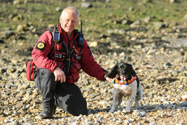 Bug Wrightson, from Hayling Island, is a volunteer with Hampshire Search & Rescue Dogs. He is pictured with his working Springer Spaniel, Oppo. Picture: Sarah Standing (061120-8820)