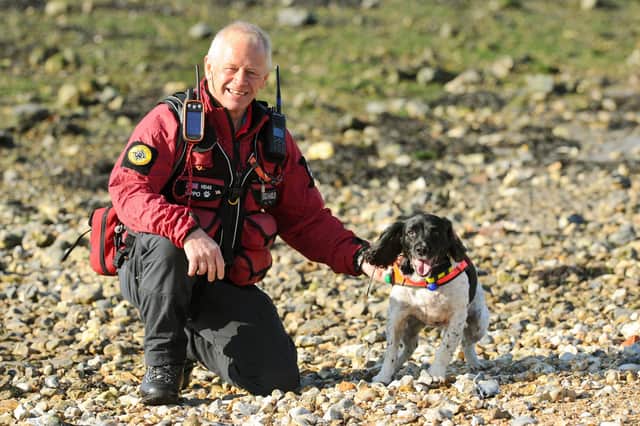 Bug Wrightson, from Hayling Island, is a volunteer with Hampshire Search & Rescue Dogs. He is pictured with his working Springer Spaniel, Oppo. Picture: Sarah Standing (061120-8820)