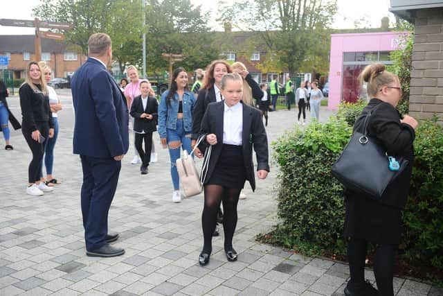 Year 7 Park Community School pupils arrive with their parents for their first day back at school after lockdown.

Sarah Standing