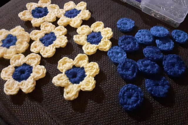 Some of the flower pins Amelia has crocheted. 