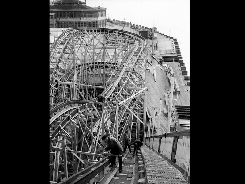 February 1936: Workmen repainting the rollercoaster at Southsea funfair. (Photo by Fox Photos/Getty Images)