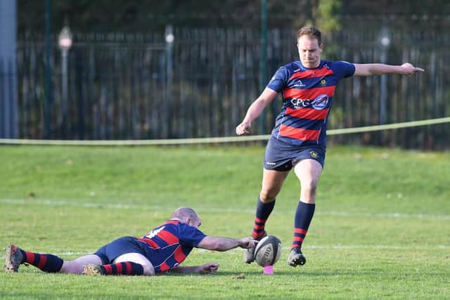 A US Portsmouth player kicks towards the posts. Picture: Neil Marshall