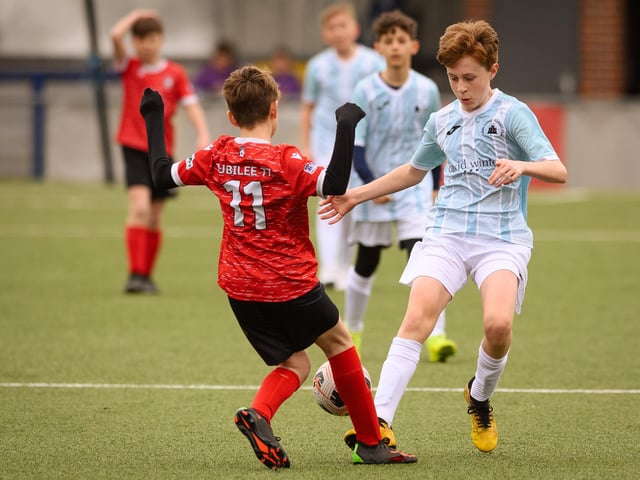Action from the Portsmouth Youth League Geldard Invitation Cup final between Jubilee 77 U13s and Castle United U13s (light blue and white kit). Picture: Keith Woodland (190321-820)