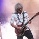 Brian May on stage at The Kings for the finale of We Will Rock You, with cast member Ian McIntosh (left). Picture: Habibur Rahman