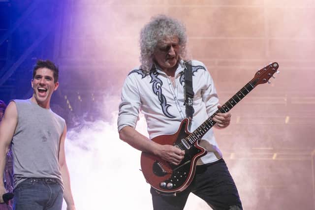 Brian May on stage at The Kings for the finale of We Will Rock You, with cast member Ian McIntosh (left). Picture: Habibur Rahman