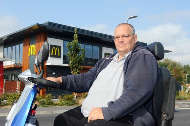 Mark Waite, 50, was denied drive-through service at a Gosport McDonald's on his mobility scooter - despite it being valid according to the company's policy. 
Picture: Sarah Standing (220920-4390)